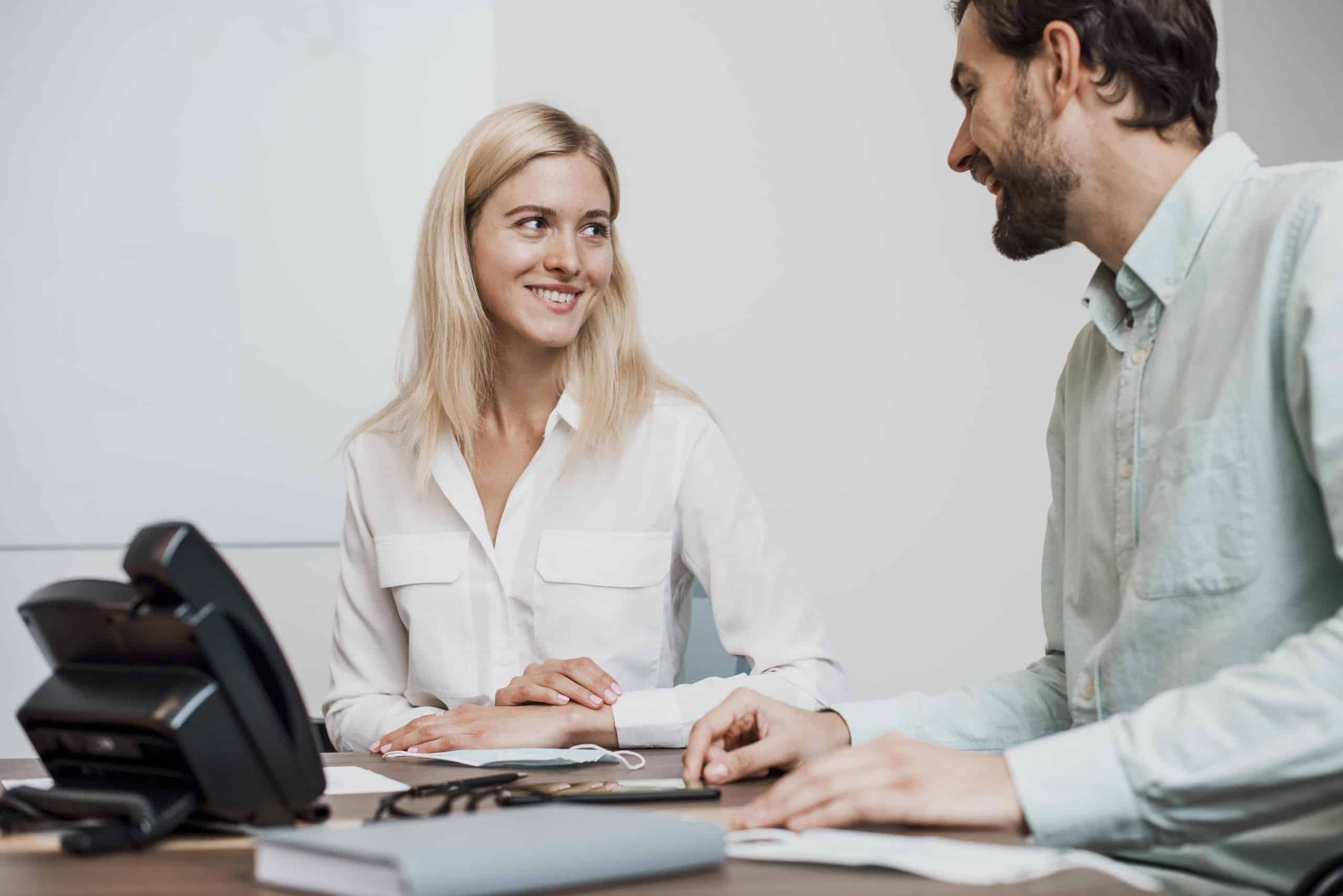 job-colleagues-sitting-desk